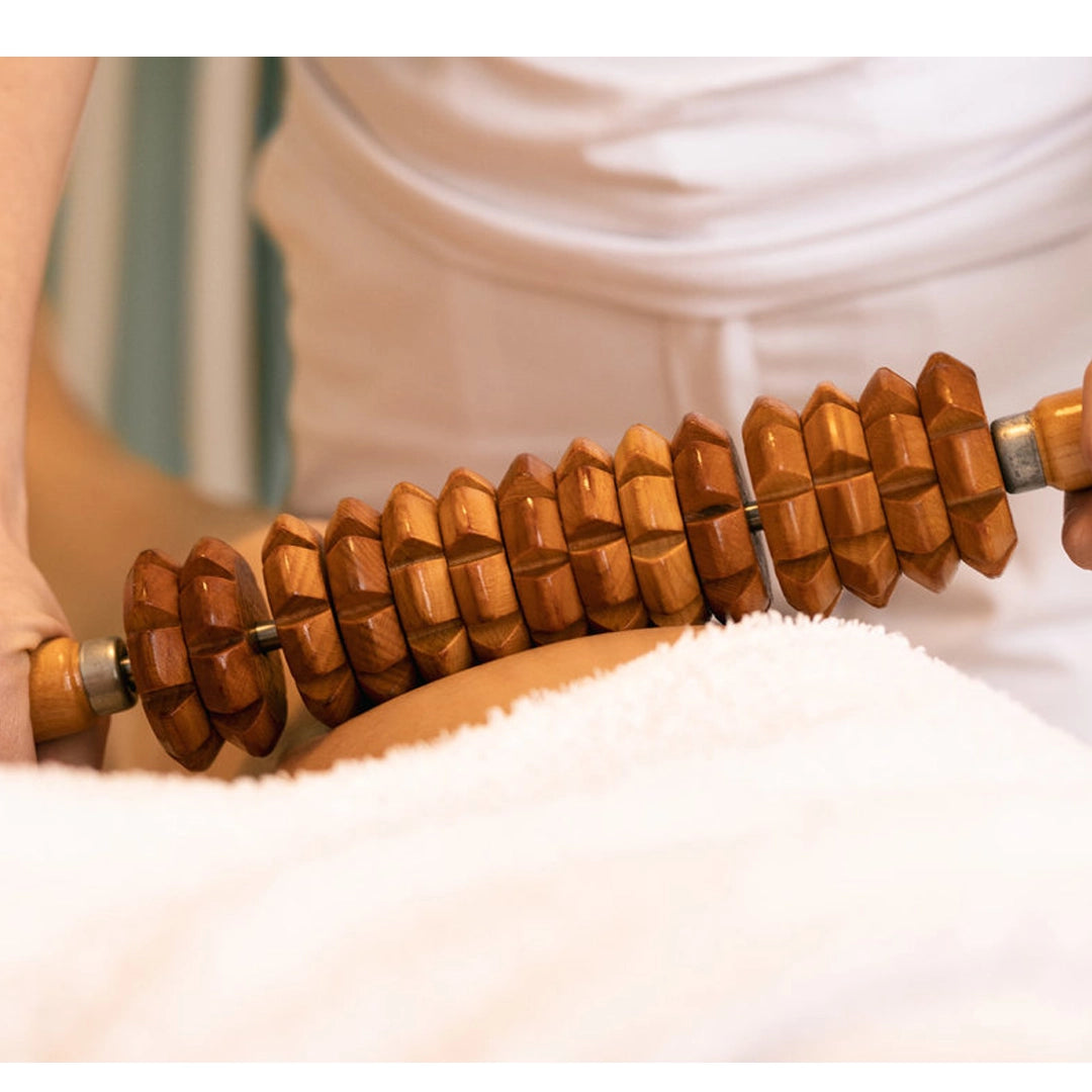 Licensed esthetician performing professional anti-cellulite body massage treatment | SlimSpa