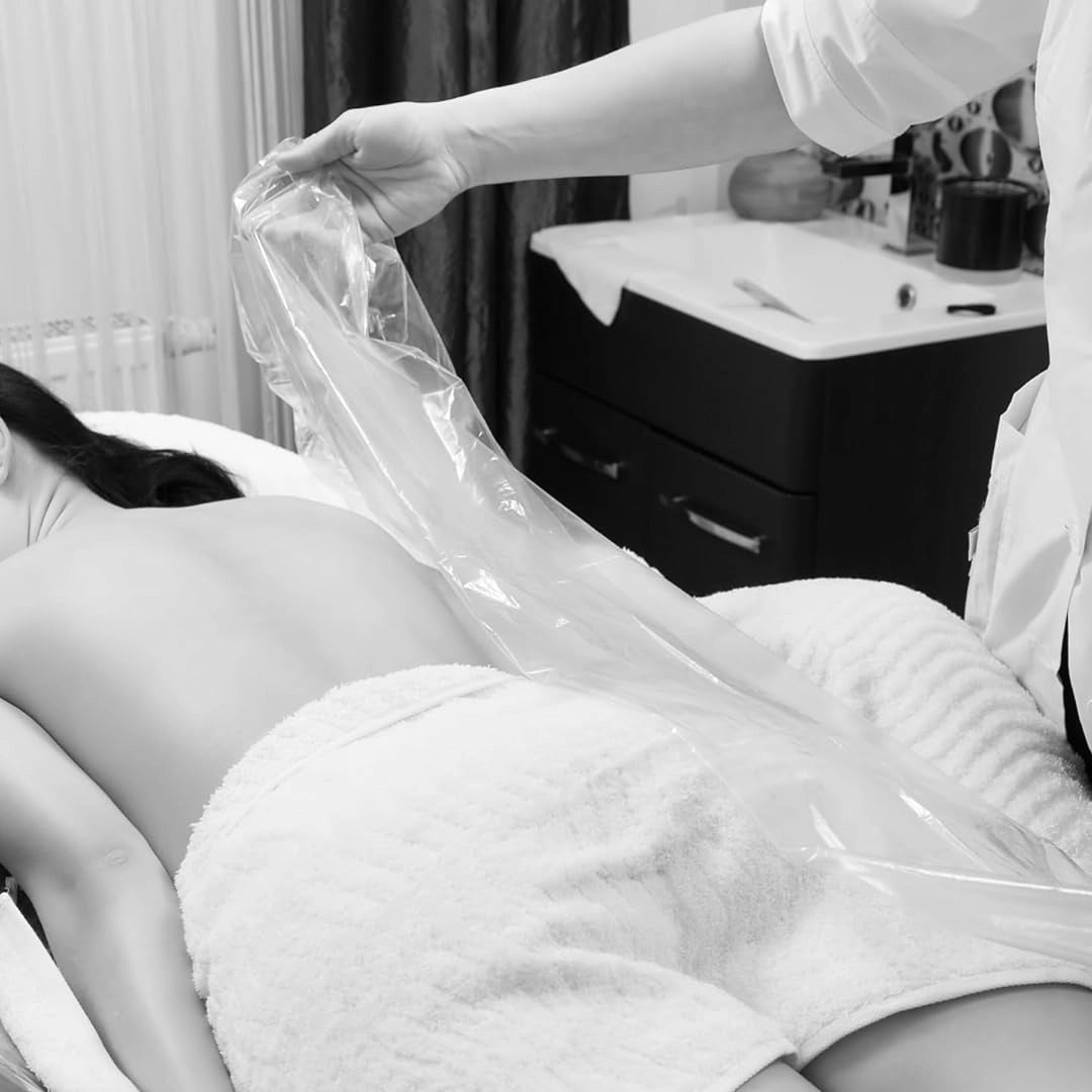 Disposable Bed Cover Sheet on treatment table — single-use hygienic table protection | SlimSpa